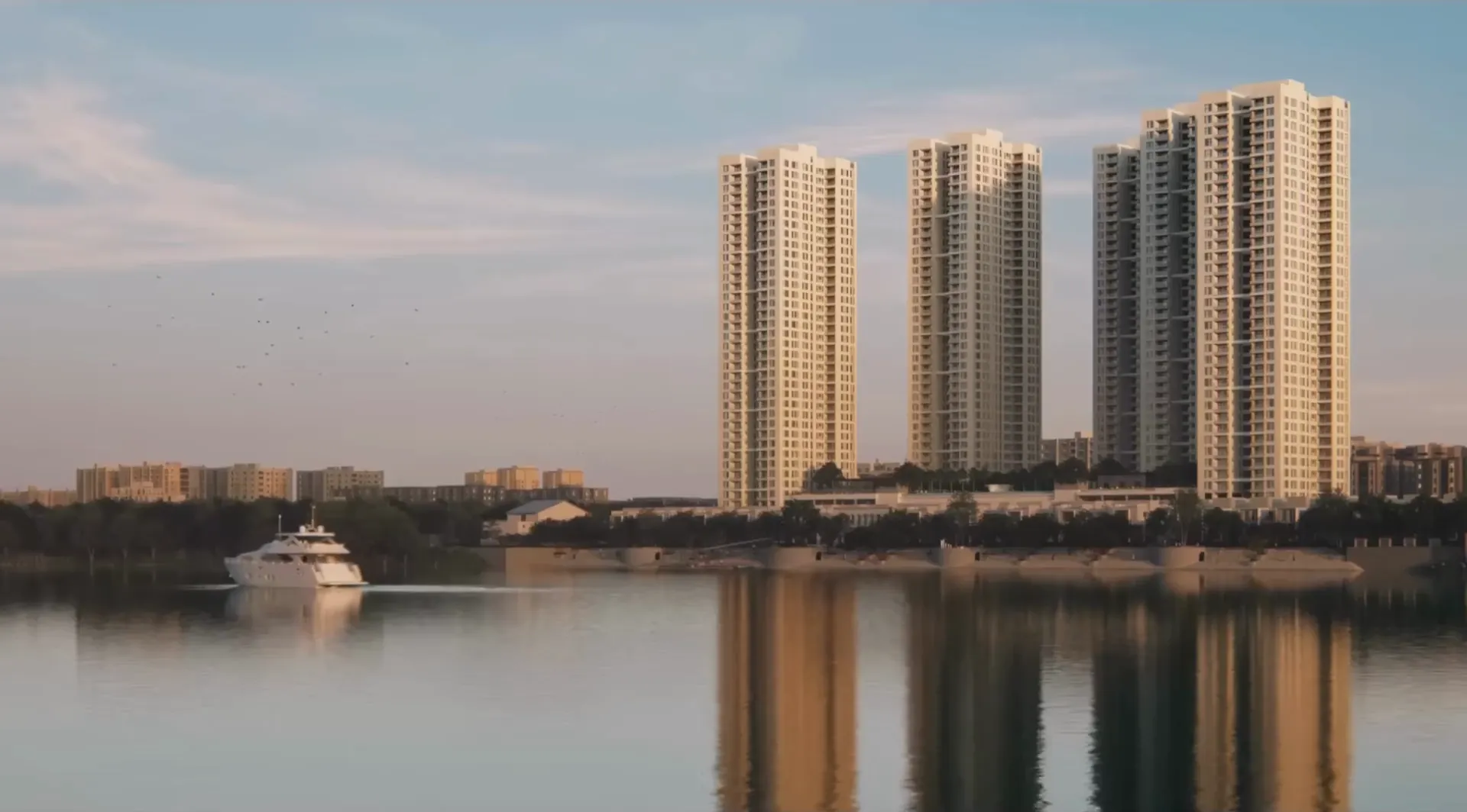 Three towers across the marina at dusk
